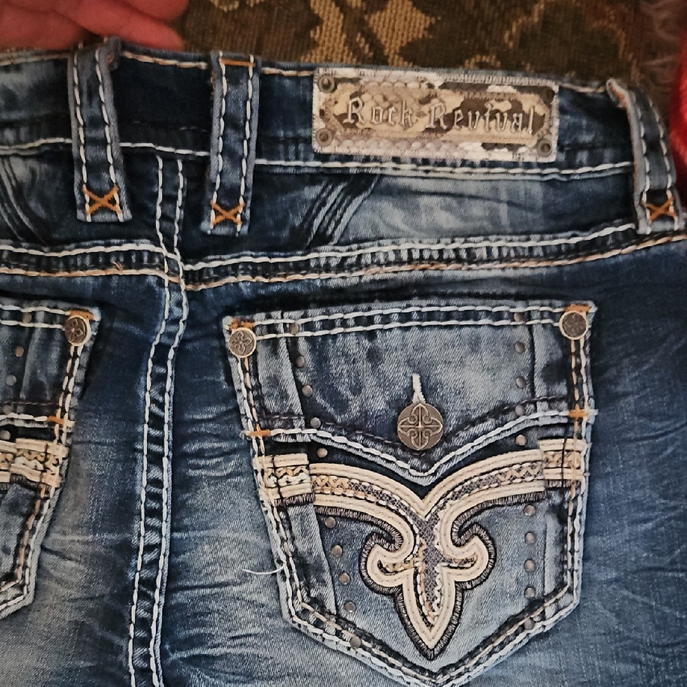 Rock Revival Blue Jeans with Ornate Stitching and Premium Denim